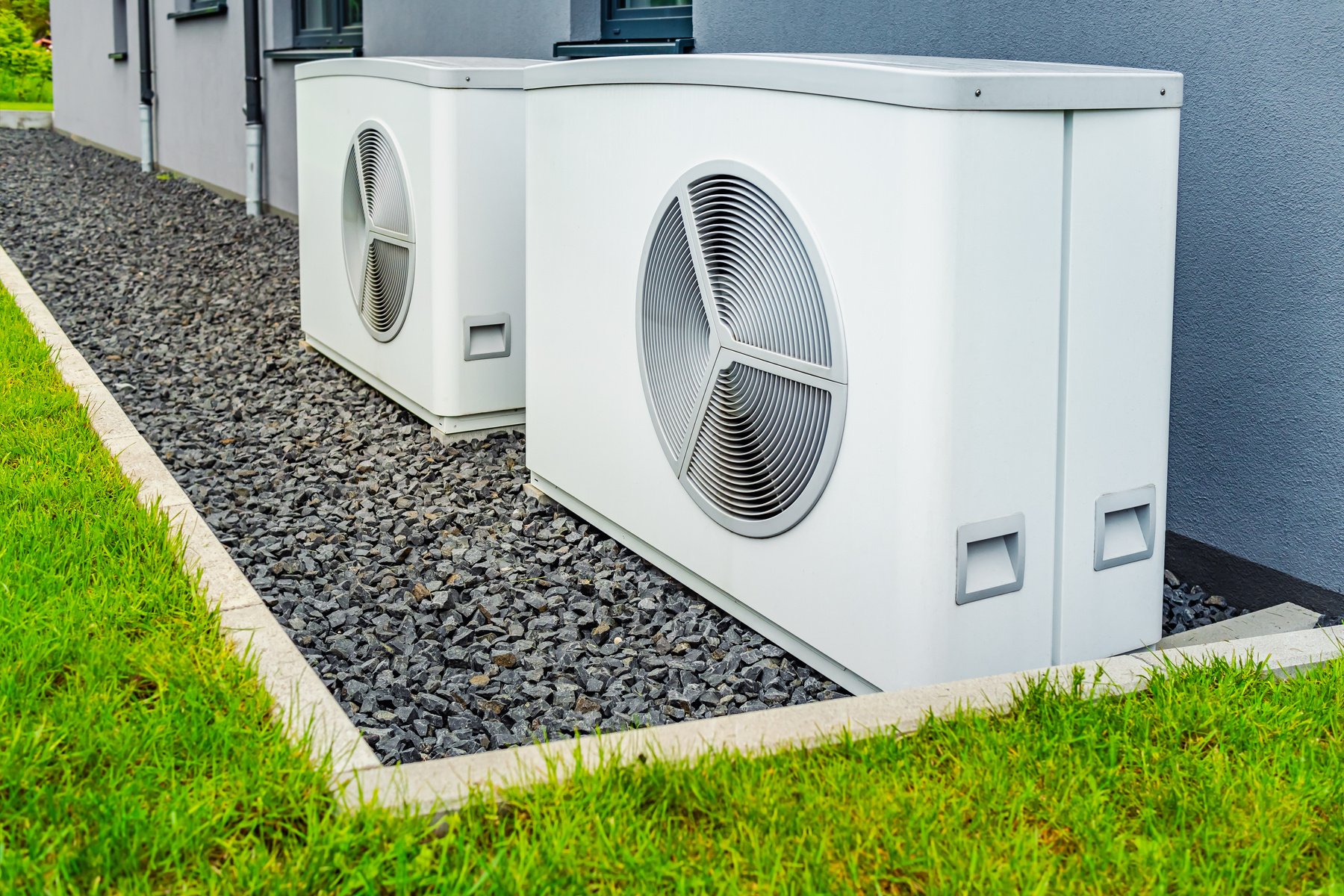 Two Air Source Heat Pumps Installed outside of New and Modern City House